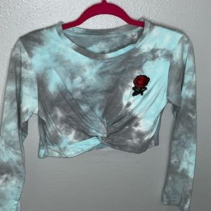 Cropped dark grey and blue cloud look shirt with a cute little rose on the side.